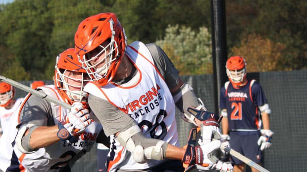 Jack Boyden dodges during Virginia men's lacrosse practice.